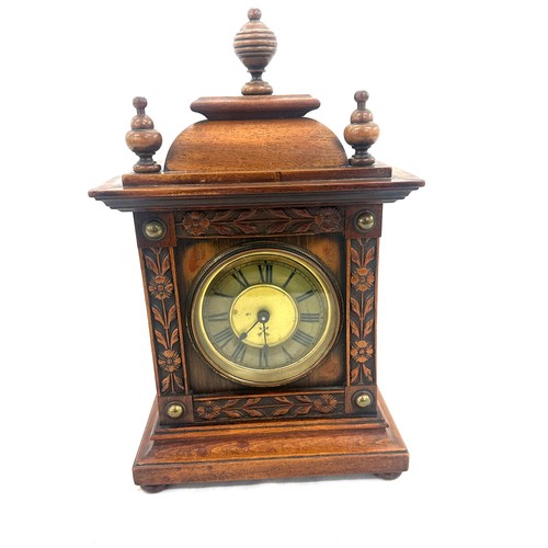 54 - Antique mahogany wind up mantel clock measures approx 14 inches tall by 8 wide, untested