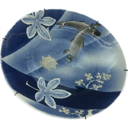 547 - Antique oriental large charger with fish scenes approx diameter 15 inches