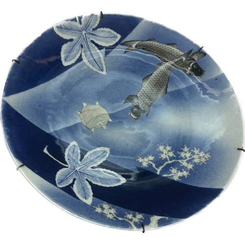 547 - Antique oriental large charger with fish scenes approx diameter 15 inches