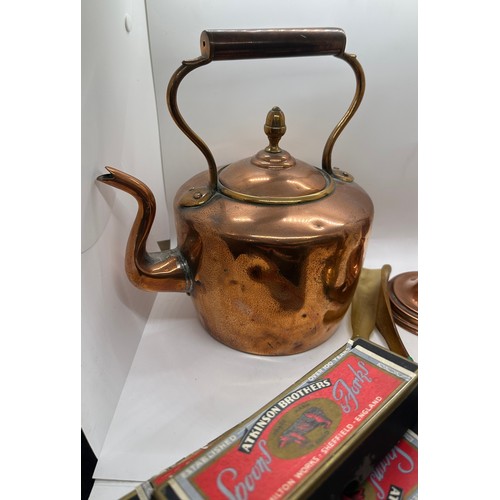 59 - Selection of metal ware to include a copper kettle and candle stick, pair of brass candle sticks and... 