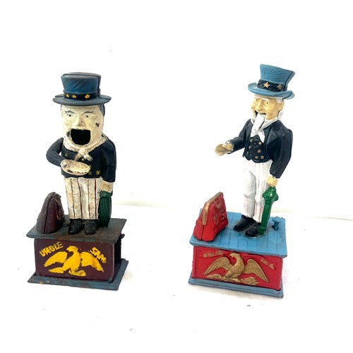 31 - Two cast iron money boxes US and Uncle Sam