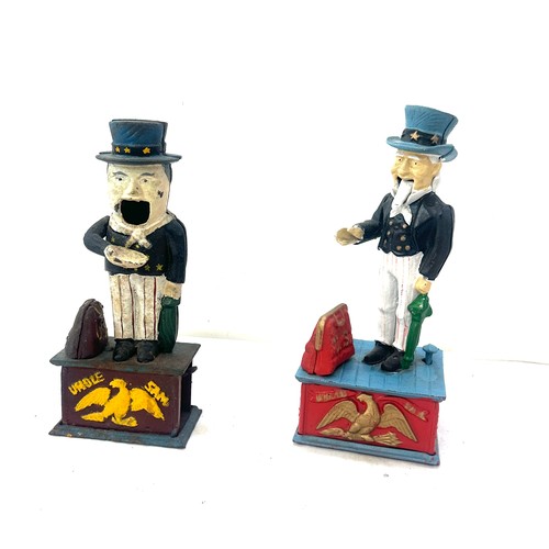 31 - Two cast iron money boxes US and Uncle Sam