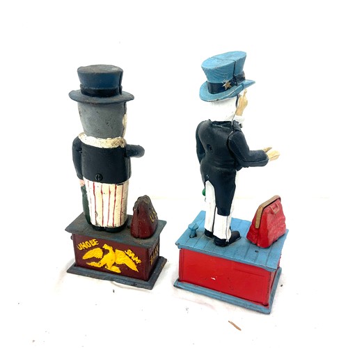 31 - Two cast iron money boxes US and Uncle Sam