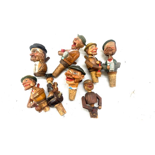 36 - Selection of wooden carved German novelty bottle tops