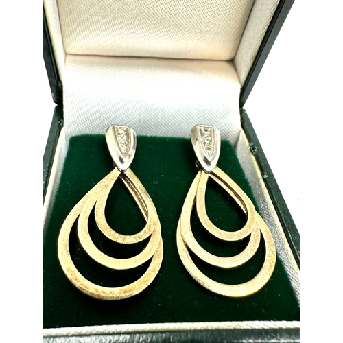 77 - 9ct gold & diamond set graduated hoop earrings measure approx 3.1cm drop weight 6.4g