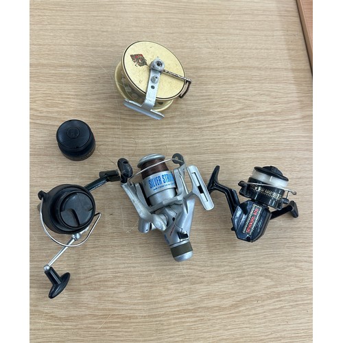 73 - Four vintage fishing reels to include Okuma, Silver striker etc