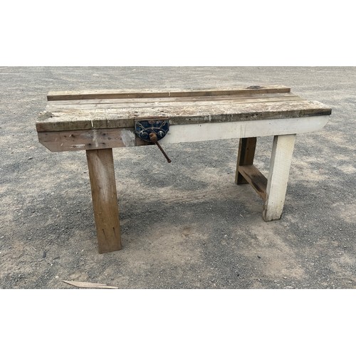 101D - Wooden workbench with table vice measures approximately 27 inches depth 67 inches wide 34 inches tal... 