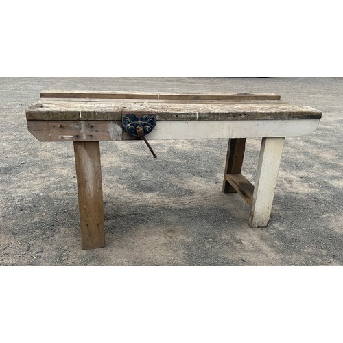 101D - Wooden workbench with table vice measures approximately 27 inches depth 67 inches wide 34 inches tal... 