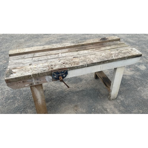 101D - Wooden workbench with table vice measures approximately 27 inches depth 67 inches wide 34 inches tal... 