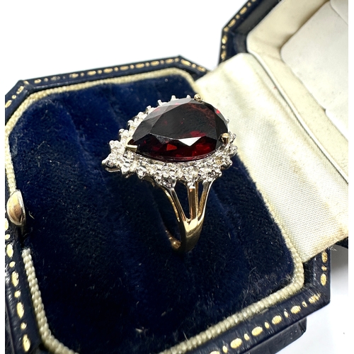 102 - 9ct gold garnet & diamond ring weight 3.4g