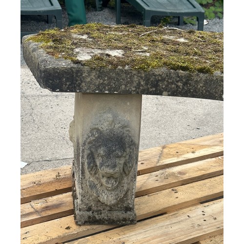 100N - Concrete garden bench with lion heads measures approx 21 inches tall by 48 wide and 19 deep