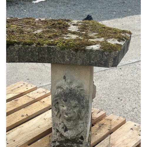 100N - Concrete garden bench with lion heads measures approx 21 inches tall by 48 wide and 19 deep