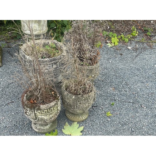 100U - Four concrete garden planters largest measures approx 15 inches tall by 15 diameter