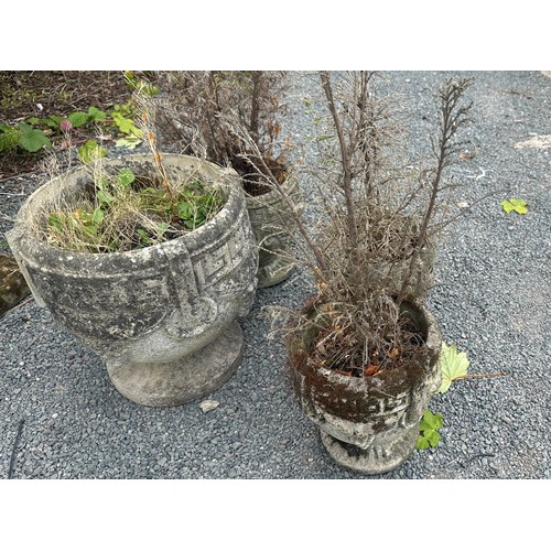 100U - Four concrete garden planters largest measures approx 15 inches tall by 15 diameter