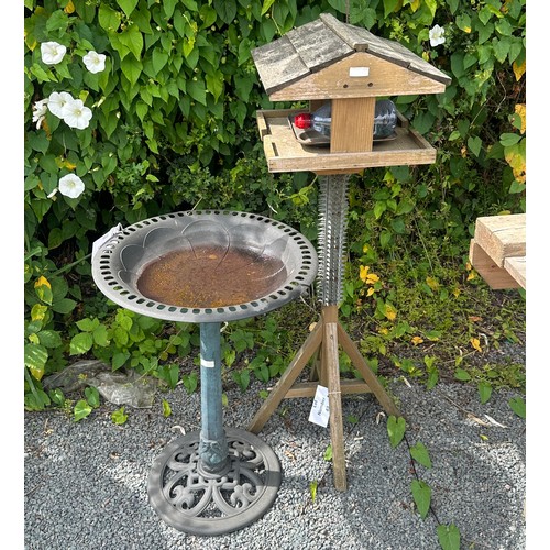 101C - Wooden bird feeder measures approx 46 inches tall and a plastic bird feeder