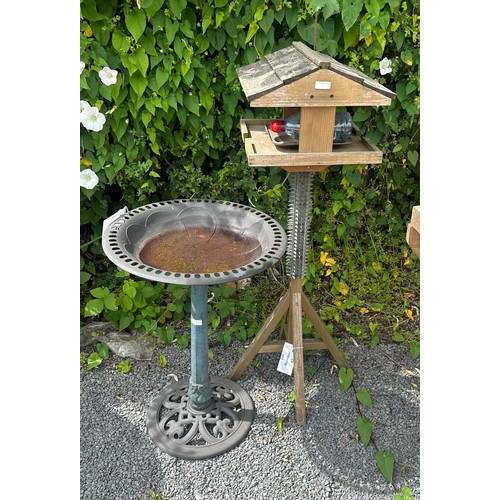 101C - Wooden bird feeder measures approx 46 inches tall and a plastic bird feeder