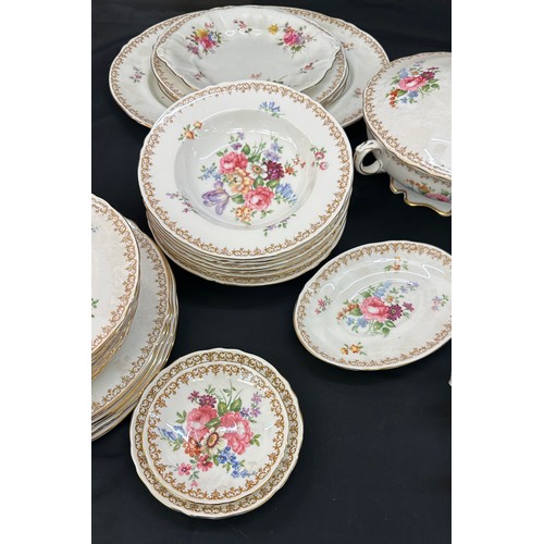 74 - Crown Staffordshire dinner and coffee set, damage to sugar bowl lid, all other pieces in good overal... 