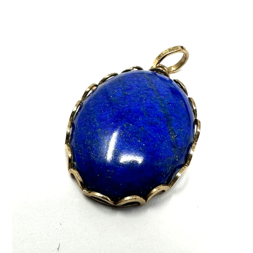 122 - 9ct gold & Lapis pendant measurtes approx 3.2cm by 1.9cm weight 6g