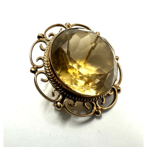 126 - 9ct gold & citrine brooch measures approx 3cm dia weight 10.1g