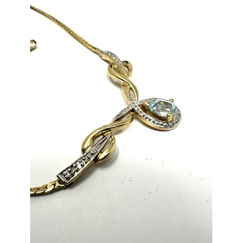 130 - 9ct gold topaz & diamond topaz necklace weight 5.8g