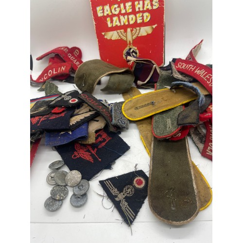 555 - Tin containing a quantity of WW2 era cloth patches including NZ airforce, Royal Winnipeg rifles, gre... 