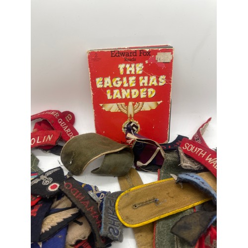 555 - Tin containing a quantity of WW2 era cloth patches including NZ airforce, Royal Winnipeg rifles, gre... 