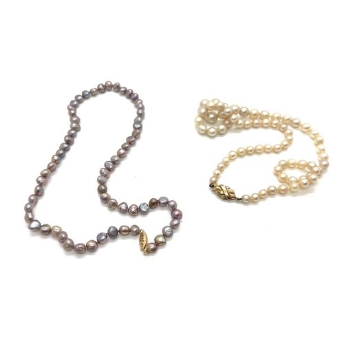 502 - Two pearl necklaces with gold clasps. one 9ct, the other 14k.