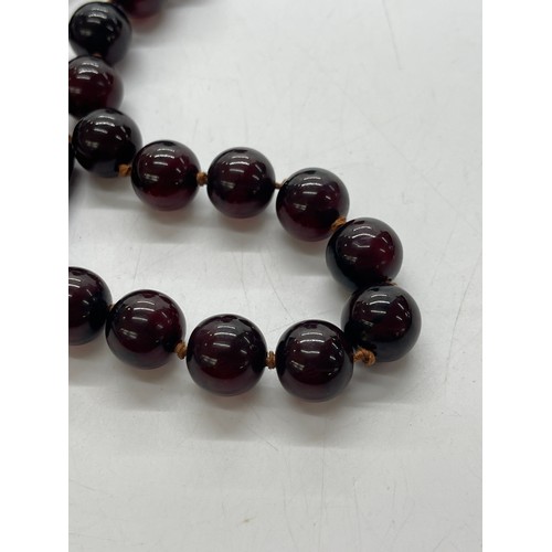 496 - Vintage cherry red amber bakelite beads weigh approx 34 grams with internal streaking and another ne... 