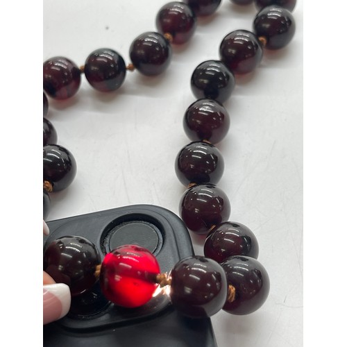 496 - Vintage cherry red amber bakelite beads weigh approx 34 grams with internal streaking and another ne... 