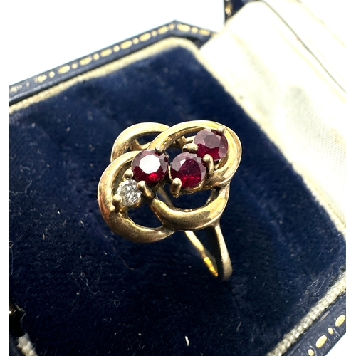 142 - 9ct gold diamond & ruby ring weight 2.7g