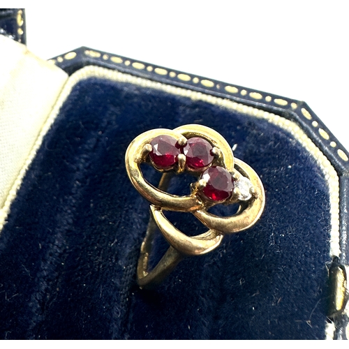 142 - 9ct gold diamond & ruby ring weight 2.7g