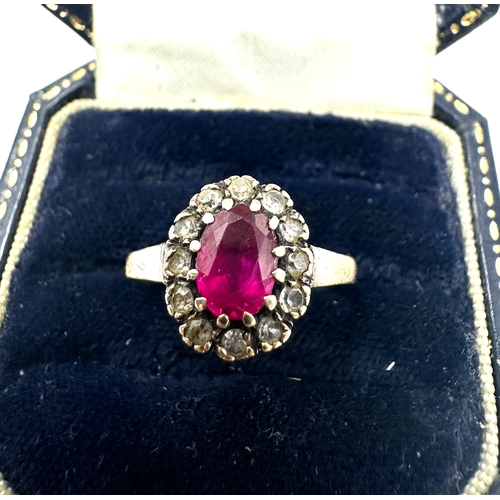 144 - 9ct gold ruby & white gemstone ring weight 2.4g