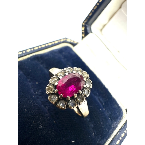 144 - 9ct gold ruby & white gemstone ring weight 2.4g