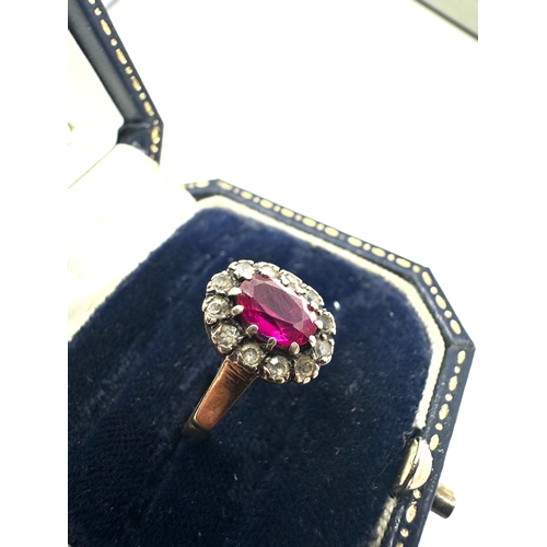 144 - 9ct gold ruby & white gemstone ring weight 2.4g