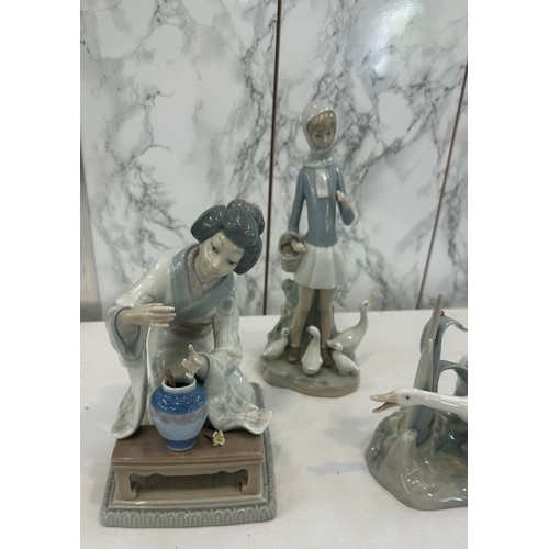 75 - Three pieces of Lladro figures to include ducks etc