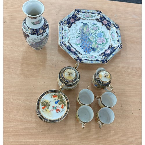 39 - Selection of oriental pottery includes oriental plate and vase etc