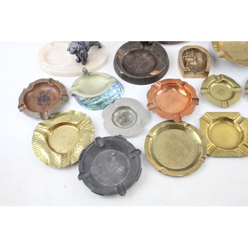 76 - Selection of ashtrays to include vintage decorative novelty, Onyx, Brass, Copper, Advertising etc