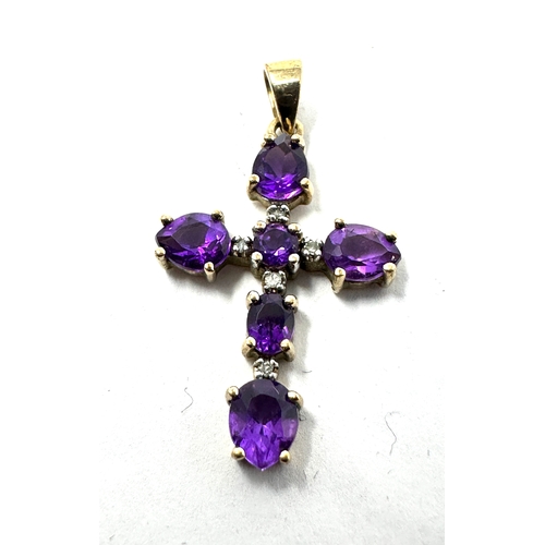 166 - 9ct gold amethyst & diamond cross measures approx 3cm drop 1.5cm wide weight 1.8g