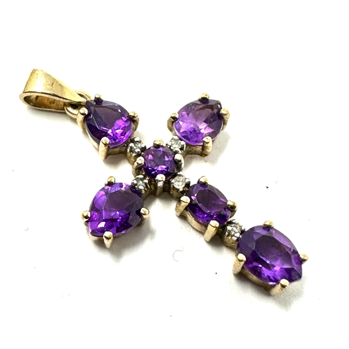 166 - 9ct gold amethyst & diamond cross measures approx 3cm drop 1.5cm wide weight 1.8g