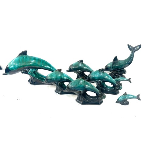 59 - Selection of Canadian blue dolphin figures largest measures approx 6 inches tall by 12 inches wide