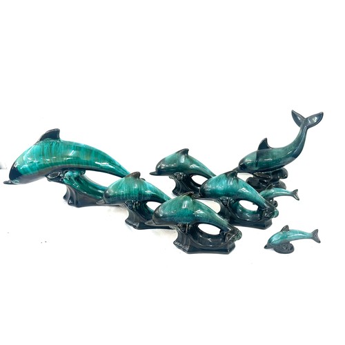 59 - Selection of Canadian blue dolphin figures largest measures approx 6 inches tall by 12 inches wide