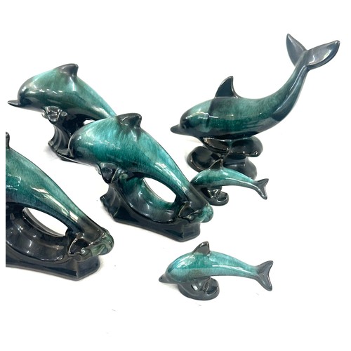 59 - Selection of Canadian blue dolphin figures largest measures approx 6 inches tall by 12 inches wide