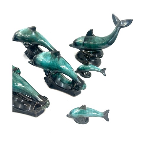 59 - Selection of Canadian blue dolphin figures largest measures approx 6 inches tall by 12 inches wide