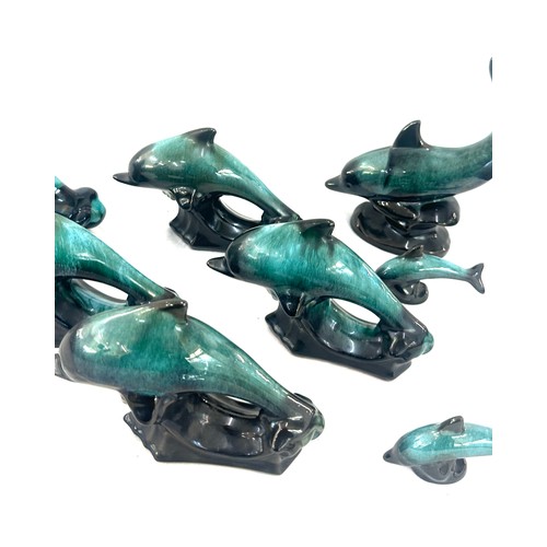 59 - Selection of Canadian blue dolphin figures largest measures approx 6 inches tall by 12 inches wide