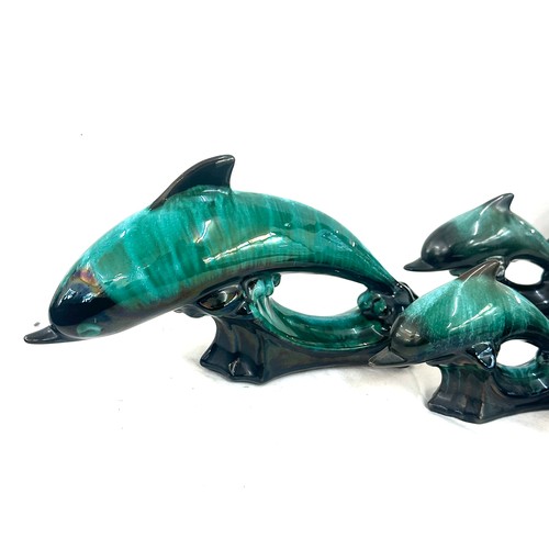 59 - Selection of Canadian blue dolphin figures largest measures approx 6 inches tall by 12 inches wide