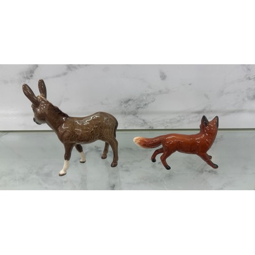 2 - Beswick donkey figure and a Beswick fox (fox a/f)