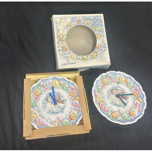 11 - 2 Royal Doulton The Snowman wall clocks, untested