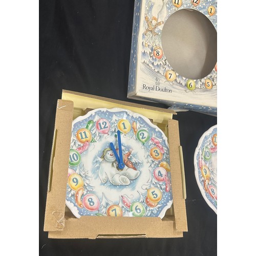 11 - 2 Royal Doulton The Snowman wall clocks, untested