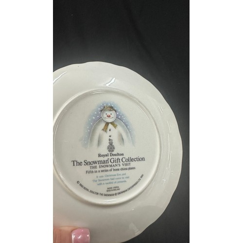 583 - Four Royal Doulton ' The Snowman' plates to include ' Dance of the Snowman', ' Snowman Christmas cak... 