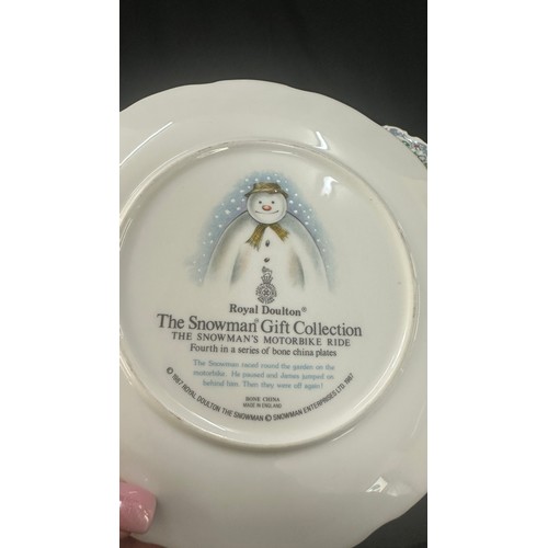 583 - Four Royal Doulton ' The Snowman' plates to include ' Dance of the Snowman', ' Snowman Christmas cak... 